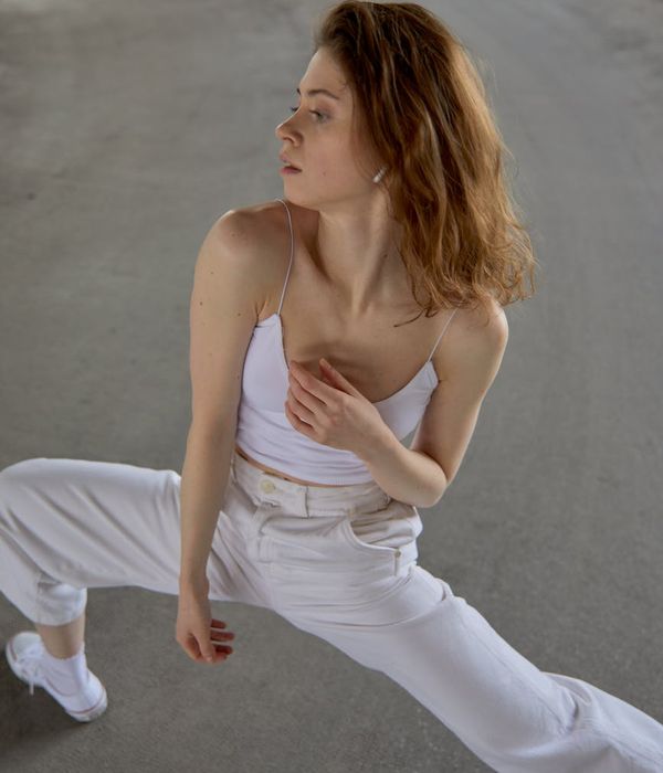 Person stretching gracefully, radiating a sense of energy and calm.